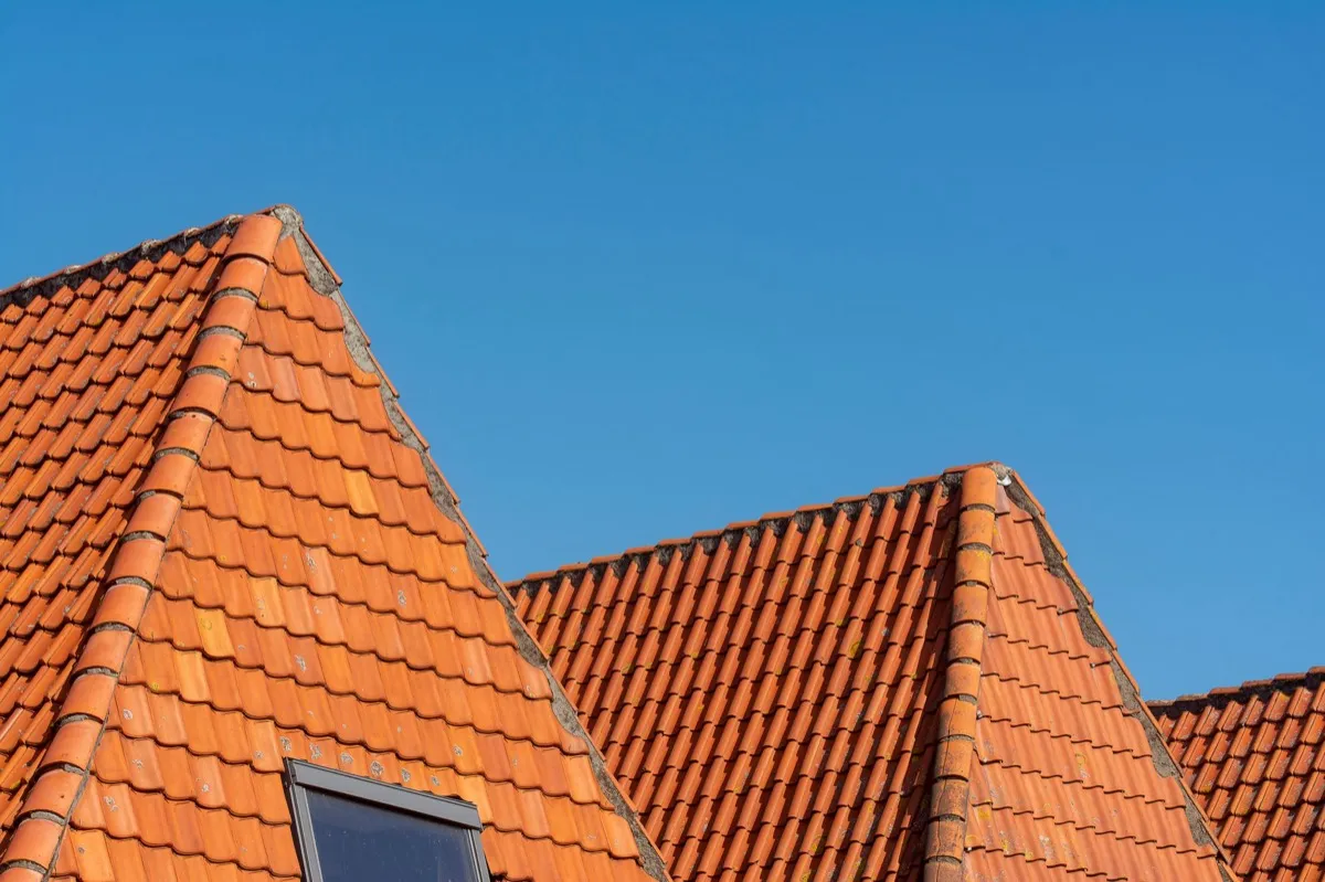 Clay barrel tile rooflines on homes in Conroe, TX