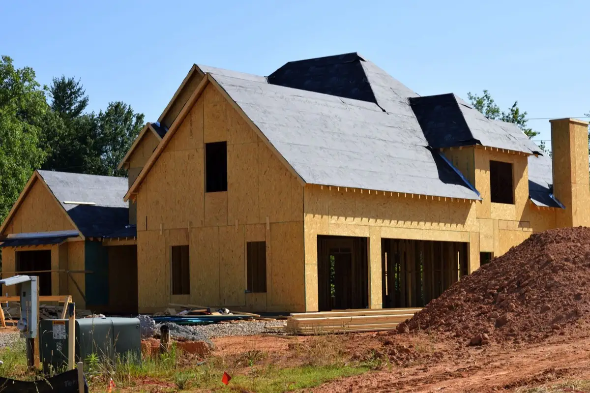 House with new roof decking and synthetic underlayment during a roof replacement in Conroe, TX