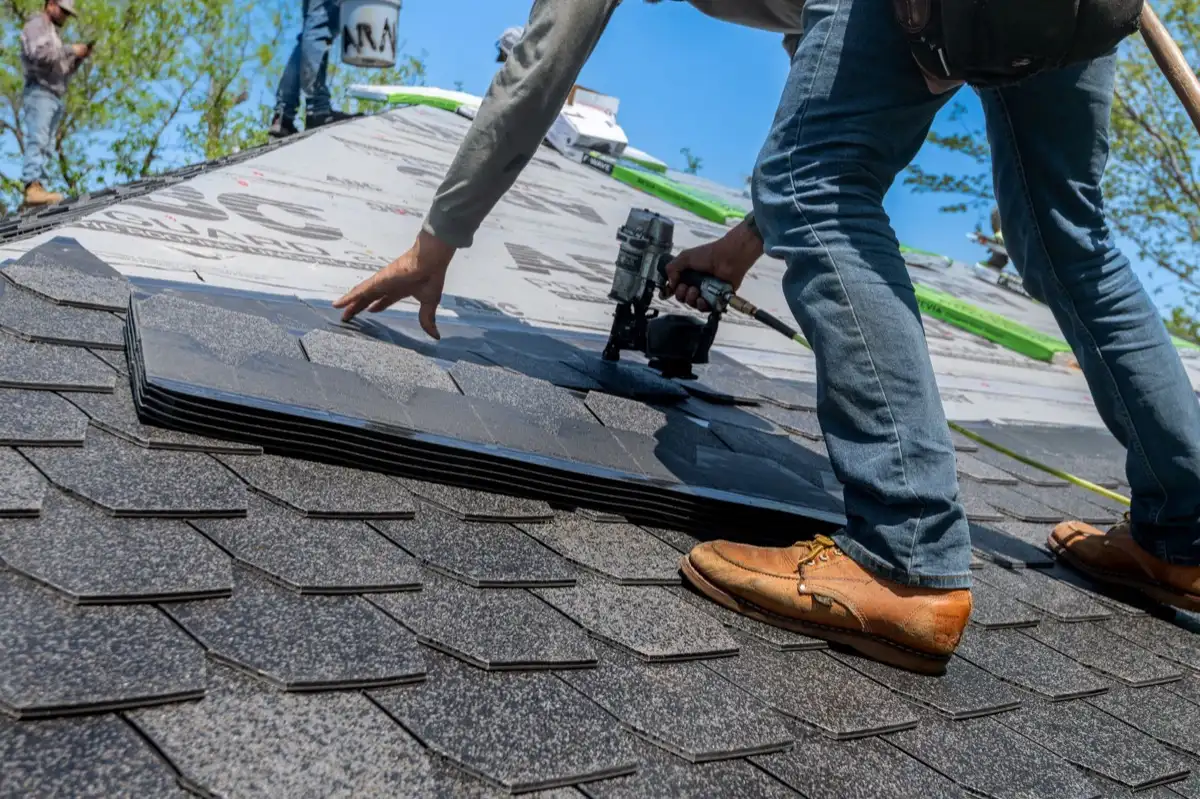 Inspecting an asphalt shingle slope after a hailstorm in Conroe, TX