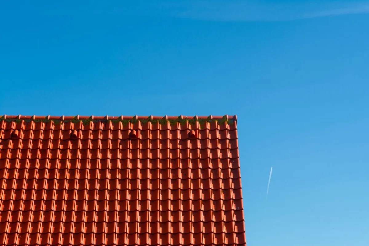 Tile roof gable in full sun, the kind of exposure that sets roof life in Conroe, TX